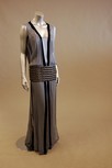 Lot 163 - A pale grey georgette tunic dress with large...