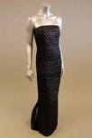 Lot 171 - A black silk strapless evening gown, with...