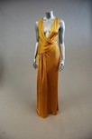 Lot 21 - A gold satin full-length evening gown, with...