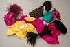Lot 214 - A group of hat veils, feathers, silk flowers,...