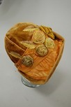 Lot 247 - An orange cloche hat, 1920s, of velvet and...