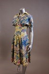Lot 255 - Two 1950s printed day dresses, one with...