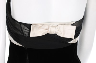 Lot 210 - A Pierre Balmain couture black velvet cocktail...