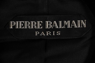 Lot 210 - A Pierre Balmain couture black velvet cocktail...