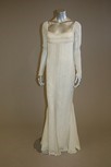 Lot 30 - An ivory chiffon empire line evening gown,...