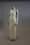 Lot 33 - An ivory silk evening/bridal gown, with silver...