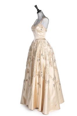 Lot 225 - A Norman Hartnell couture ivory satin bridal...