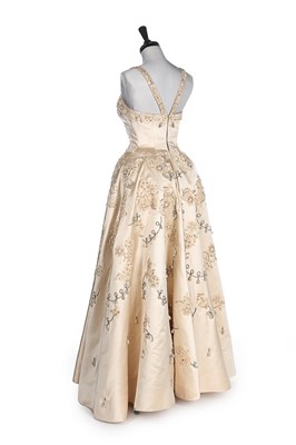 Lot 225 - A Norman Hartnell couture ivory satin bridal...