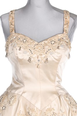 Lot 225 - A Norman Hartnell couture ivory satin bridal...