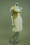 Lot 58 - A ivory chiffon and gold sequined cocktail...