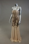 Lot 61 - A beige chiffon strapless evening gown, the...
