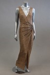 Lot 74 - A beige chiffon evening gown with trompe...