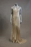 Lot 80 - An ivory chiffon evening gown, with graduated...