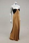 Lot 89 - A gold silk jersey strapless evening gown,...