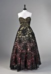 Lot 156 - A dramatic black guipure couture ball gown...