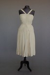 Lot 125 - A Paquin pleated ivory chiffon couture...