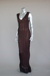 Lot 260 - An Azzedine Alaia black lace knit evening gown,...