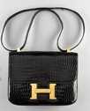 Lot 8 - An Hermès Constance black crocodile handbag,...