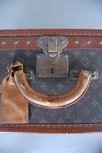 Lot 9 - A Louis Vuitton hard sided suitcase, the...