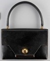 Lot 2 - An Hermès black pig-skin 'Ecrou' bag, 1956,...