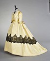 Lot 68 - A pale yellow ottoman velvet evening gown,...