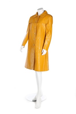 Lot 207 - A Pierre Cardin mustard vinyl coat, circa 1970,...