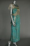 Lot 101 - A turquoise and gold brocaded satin evening...