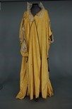 Lot 66 - An embroidered yellow silk tea gown, circa...