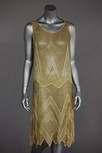 Lot 89 - A beaded flapper dress and evening coat, late...