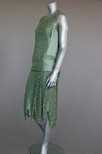 Lot 98 - A Jeanne Paquin labelled green lace and satin...