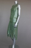 Lot 98 - A Jeanne Paquin labelled green lace and satin...