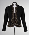 Lot 110 - A Schiaparelli black wool evening jacket,...