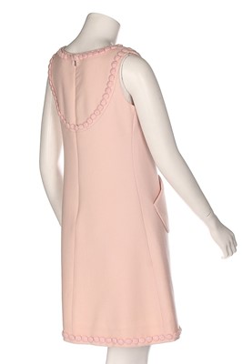 Lot 229 - An André Courrèges couture pink wool cocktail...