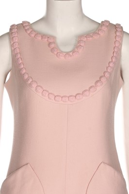 Lot 229 - An André Courrèges couture pink wool cocktail...
