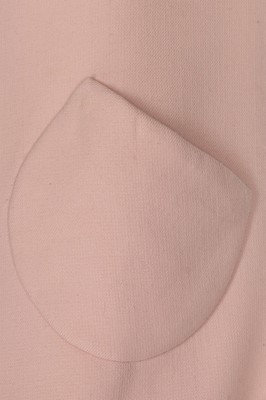Lot 229 - An André Courrèges couture pink wool cocktail...