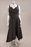 Lot 90 - A Neiman Marcus black silk faille evening gown,...