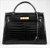Lot 13 - An Hermès black crocodile Kelly bag, 1986,...