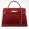 Lot 3 - An Hermès wine-red crocodile Kelly bag, 1988,...