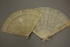 Lot 34 - Two carved ivory brisfans, Cantonese for...