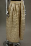 Lot 48 - A quilted ivory silk petticoat, late...