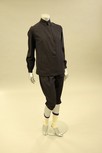 Lot 54 - A fine and rare navy wool ski suit, 1924,...