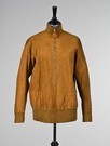 Lot 56 - An early Hermès brown suede sporting blouson...