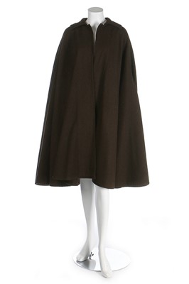 Lot 242 - An Yves Saint Laurent brown tweed cape, 1970s,...