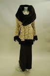 Lot 113 - A Norma Kamali black bias-cut sheath with cowl...