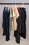 Lot 147 - A group of bespoke suits, blouses and dresses,...