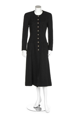 Lot 147 - A Chanel black wool bouclé coat, 1990s,...