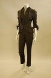 Lot 92 - A John Galliano black linen trouser suit, the...