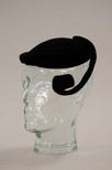 Lot 21 - A Balenciaga black velvet comma-curl toque,...