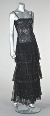 Lot 297 - A Lancetti jewelled black tulle cocktail dress,...
