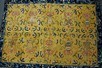 Lot 65 - An embroidered yellow satin Buddhist panel...